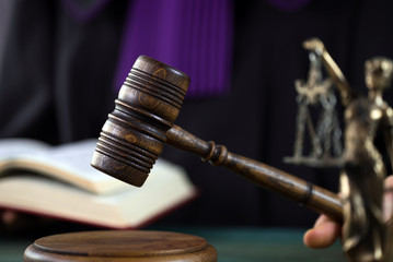 Law concept,Judge In A Courtroom Striking The Mallet © Aerial Mike