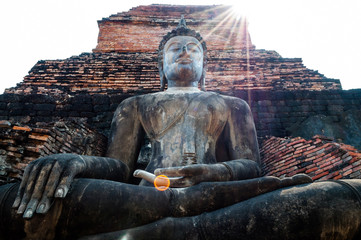 buddha statue and ancient ruin in sukhothai
