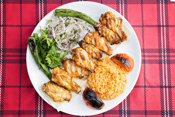 Chicken wings served on plate