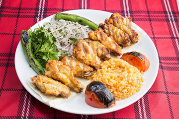 Chicken wings served on plate