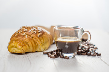 Italian breakfast: espresso coffee and croissant