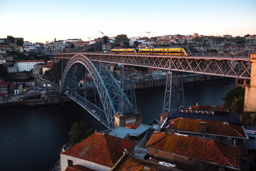 View of the Douro river and Dom Luis I Bridge at dusk, Porto, Portugal.