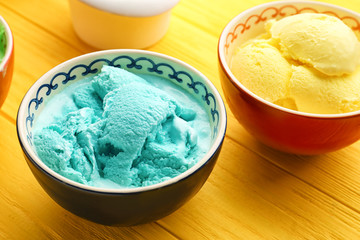 Ice cream collection in bowls on wooden background