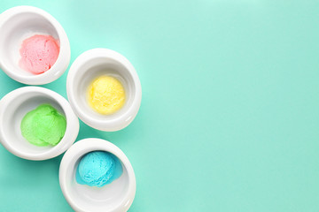 Ice cream collection in bowls on color background