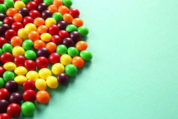 Colorful candies on color background, closeup