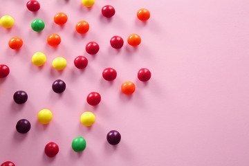 Colorful candies on color background