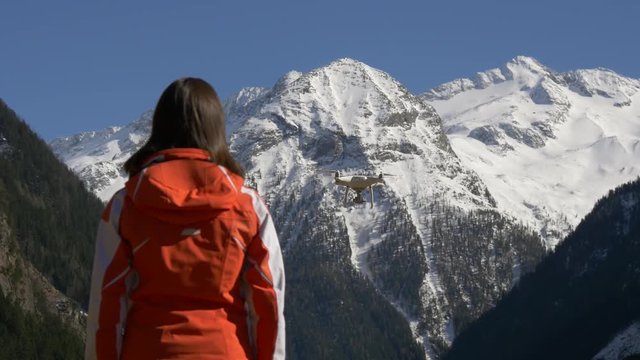 Silhouette of a woman and a multicopter