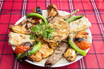 mixed kebab served on plate