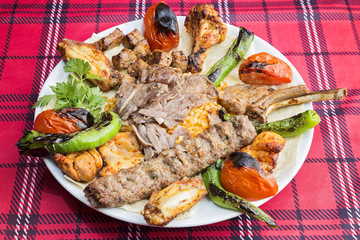 mixed kebab served on plate