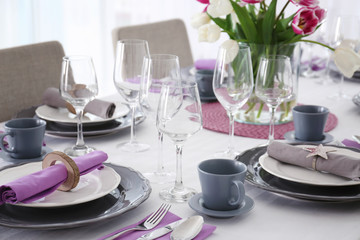 Table with beautiful setting in restaurant, closeup