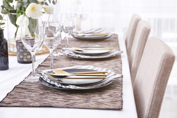 Table with beautiful setting in restaurant, closeup