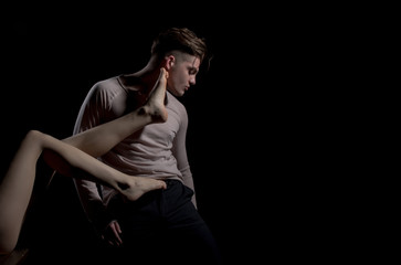 Obraz premium Sexy, naked, female legs touching handsome man