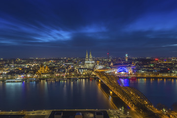 Fototapeta na wymiar Cologne, Germany - Aerial skyline view of Cologne with the beautiful Cologne Cathedral, Rhine River and Hohenzollern Bridge by night
