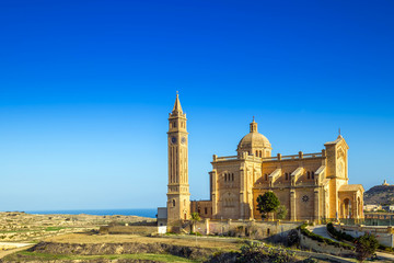 Obraz premium Gozo, Malta - The Basilica of the National Shrine of the Blessed Virgin of Ta' Pinu early at the morning with clear blue sky on a summer day