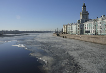 Fototapeta na wymiar Spring came. Sunny day. View of the Neva river embankment. The river is free of ice.