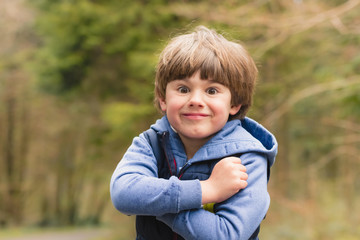 Outdoor portrait of cute young boy