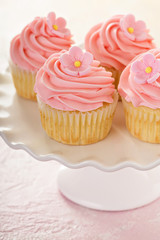 Vanilla cupcakes with pink raspberry frosting