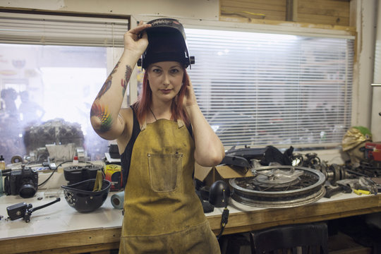 Portrait of woman standing in garage