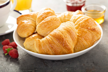 Freshly baked croissants in a bowl