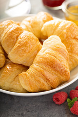 Freshly baked croissants in a bowl