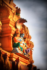 Fototapeta premium Hindu god Vishnu statue on the exterior temple wall