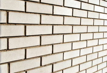 Perspective of white brick wall; abstract background.