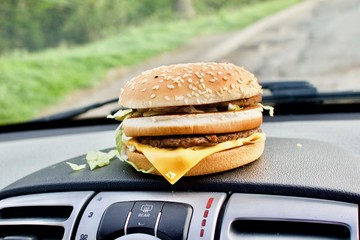 Cheeseburger in car
