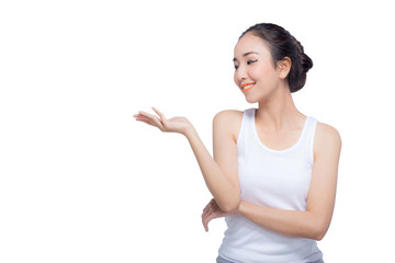 Beauty spa woman with perfect face skin Portrait. Beautiful Spa Girl showing empty copy space on the open hand palm for text. Proposing a product.