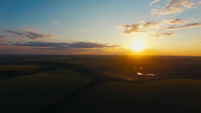 Flying over the lield at Sunset