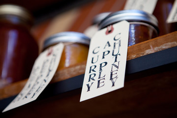 Shelf with Jars of Curry Apple Chutney Preserves