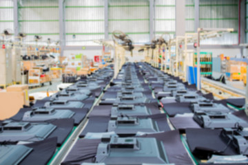 Obraz premium TV on the conveyor belt in a production plant.