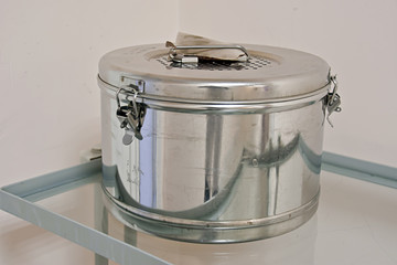 sterilizer box on a medical gurney, medical instruments