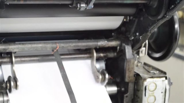 Old offset machine printing flyers