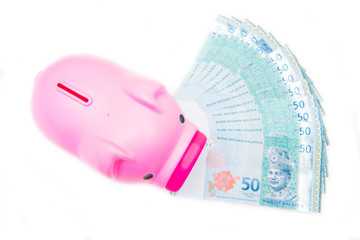 bank note of Ringgit Malaysia and piggy bank