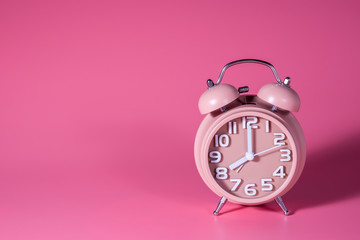 alarm clock on pink background
