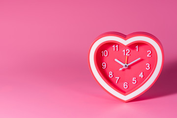 alarm clock on pink background