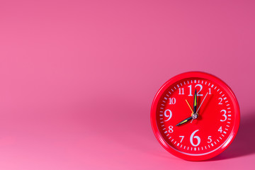alarm clock on pink background