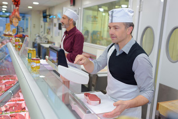 Butcher serving steak