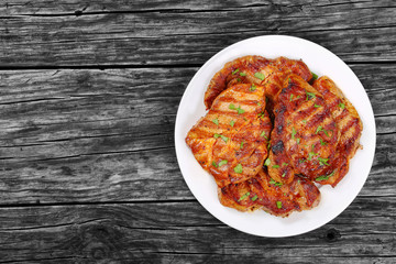 juicy pork chops on white plate