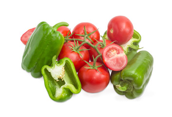 Branch of the ripe red tomatoes and green bell peppers