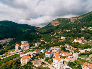 Fototapeta na wymiar Construction of a multistory building in Budva, Podmayne district, near the monastery, Montenegro. aerial survey