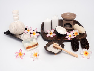 Obraz na płótnie Canvas Aromatherapy product Spa set ,candle ,soap,coconut,flower,shell, massage with wood background .