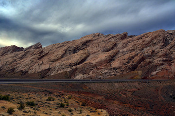 Silent City and Road/Storm clouds over a rocky landscape and desolate road