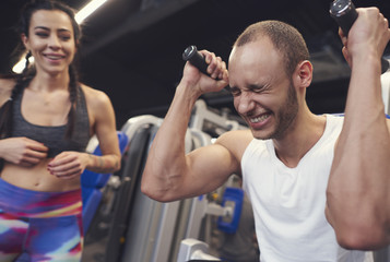 Fototapeta premium Exercise challenges between fit couple