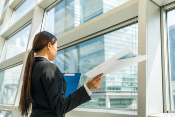 businesswoman looking at documents