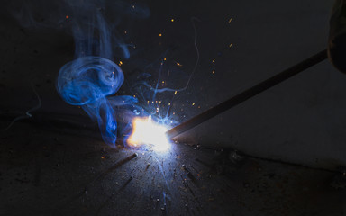 SMAW – Shielded matal arc welging and welding flame at spark  point.