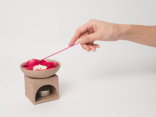 Aromatherapy  product  Spa massage set  hold by hand   with white background .