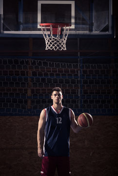 basketball player, ball indoors rim net