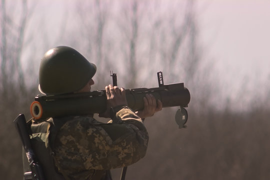 Military shooting from bazooka at warfield