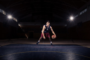 one basketball player dribble ball - obrazy, fototapety, plakaty